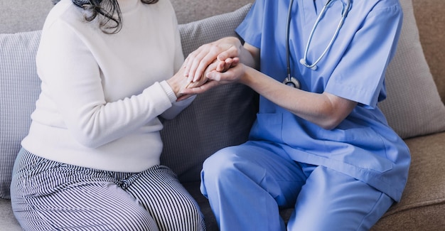 Homecare nursing service and elderly people cardiology healthcare Close up of young hispanic female doctor nurse check mature caucasian man patient heartbeat using stethoscope during visit