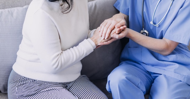 Homecare nursing service and elderly people cardiology healthcare Close up of young hispanic female doctor nurse check mature caucasian man patient heartbeat using stethoscope during visit