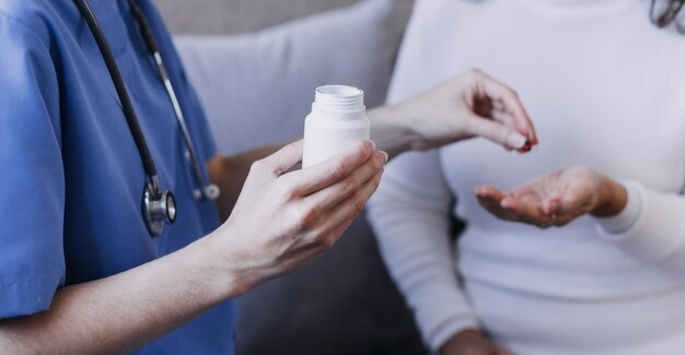 Homecare nursing service and elderly people cardiology healthcare Close up of young hispanic female doctor nurse check mature caucasian man patient heartbeat using stethoscope during visit