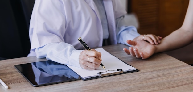 Homecare nursing service and elderly people cardiology healthcare Close up of young hispanic female doctor nurse check mature caucasian man patient heartbeat using stethoscope during visit