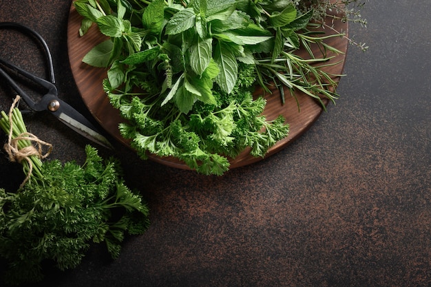 Homegrown fresh parsley mint thyme rosemary on brown