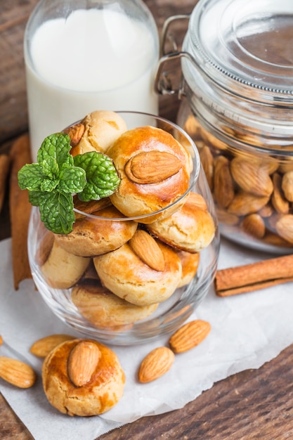 Homemade Almond cookies on a shabby wooden table background.