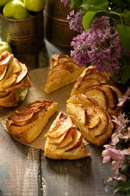 homemade apple cinnamon scones with lilac flowers and apple blooming branches