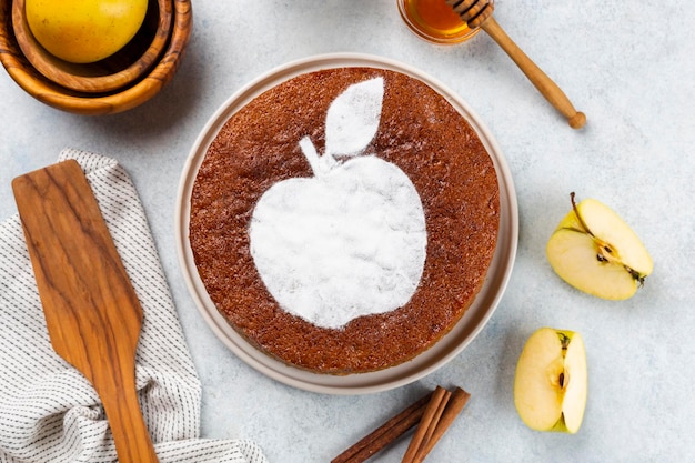 Homemade apple pie on a white wooden background top view The classic autumn dessert for Thanksgiving is organic apple pie