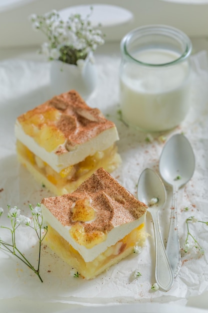 Homemade apple pie with apples and cream