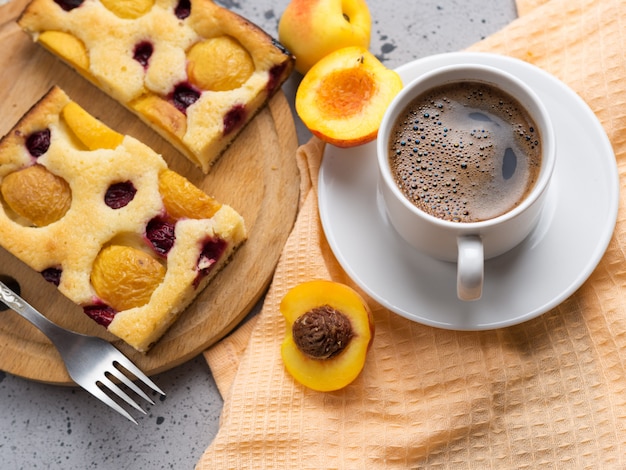 Homemade apricot pie and a Cup of espresso. Breakfast