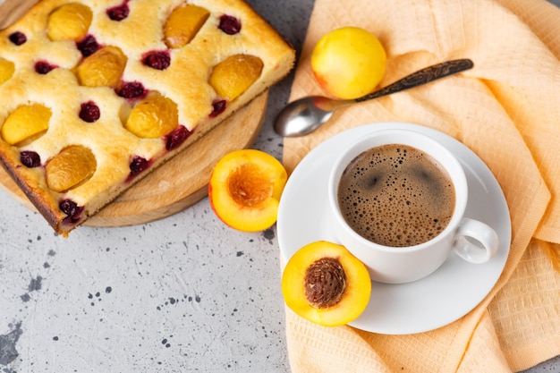 Homemade apricot pie top view espresso coffee cup