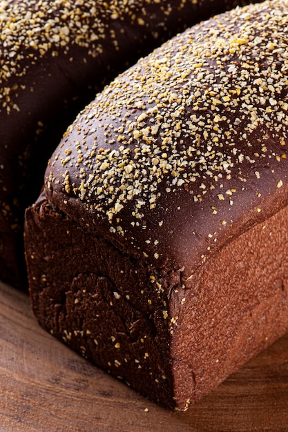 Homemade Australian bread with dark wholemeal flour on wooden board