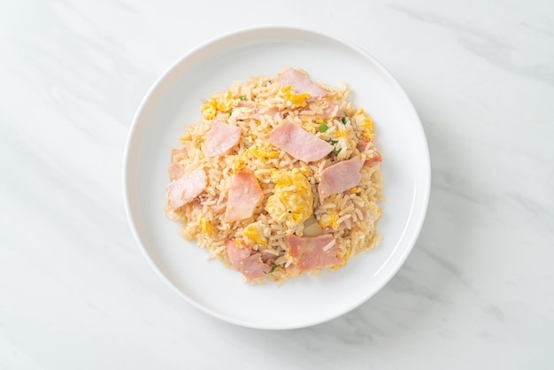 homemade bacon ham fried rice on white plate