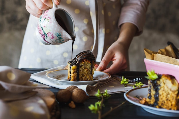 Homemade banana cake pouring with hot liquid chocolate