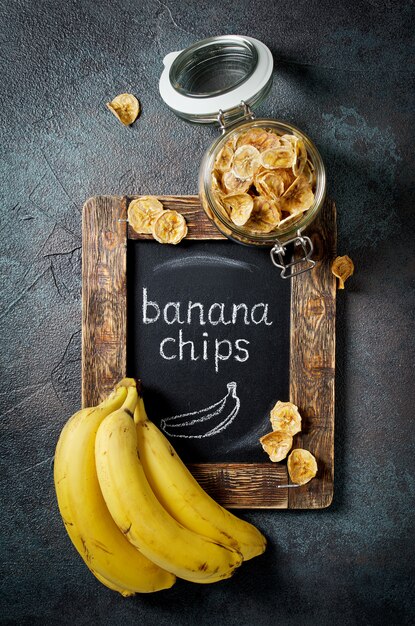 Homemade banana chips in a glass jar