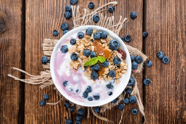 Homemade Blueberry Yogurt in a small bowl garnished with fresh fruits