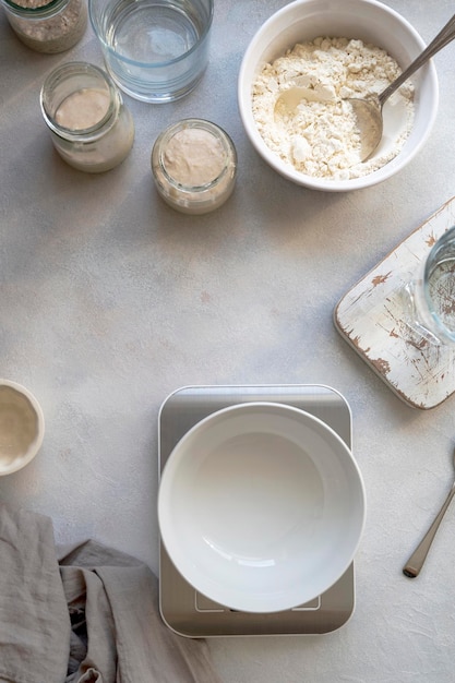 Homemade breadmaking with sourdough using wild yeast busy lifestyle scene of baking at home top view Sustainable living