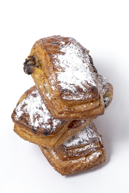 Homemade buns with chocolate and icing sugar