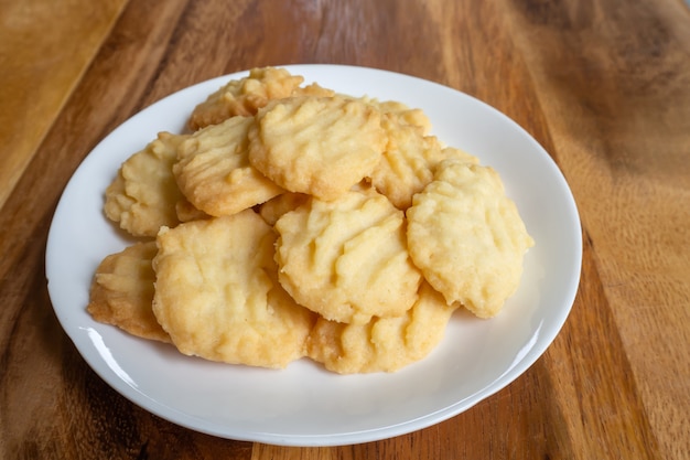 Homemade butter cookies on wooden table. Sweet dessert.