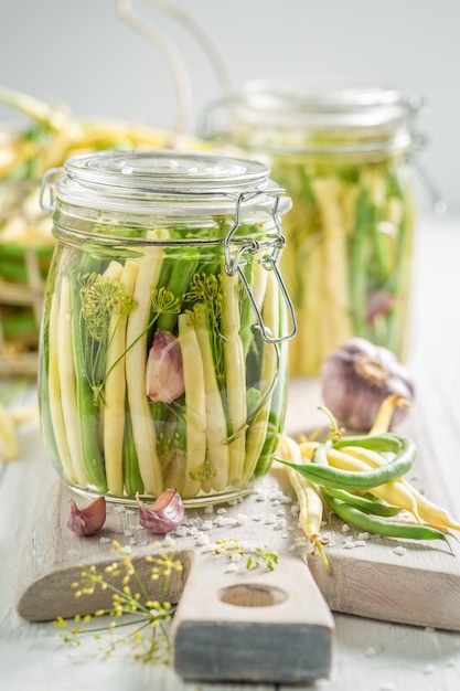 Homemade canned yellow and green beans with galic and dill