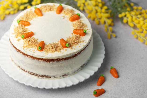 Homemade carrot cake made with walnuts iced with cream cheese Sweet dessert