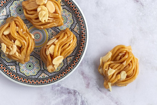 Homemade chebakias pastries typical Moroccan sweets with honey for Ramadan and aid halalfood