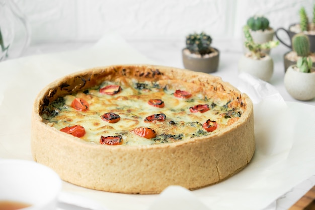 Homemade cheesy spinach quiche for brunch