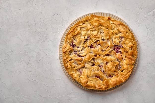 Homemade cherry pie from filo dough flat lay copy space