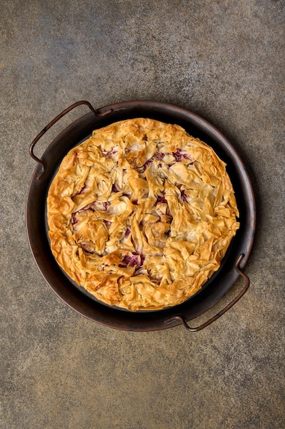 Homemade cherry pie or tart from filo dough top view vertical orientation