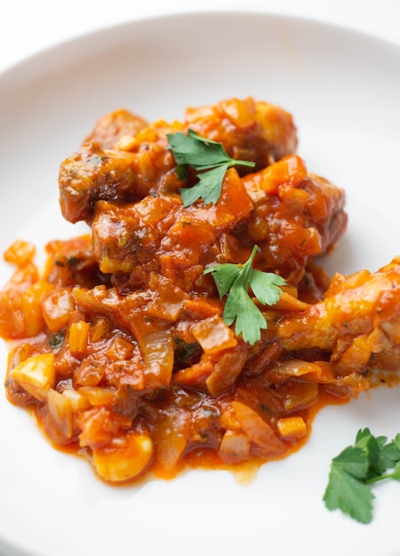 Homemade chicken dish with tomato sauce and spices