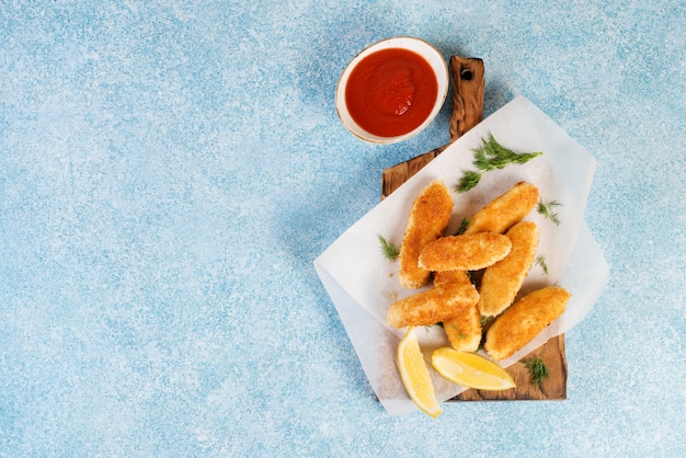 Homemade chicken nuggets with tomato sauce