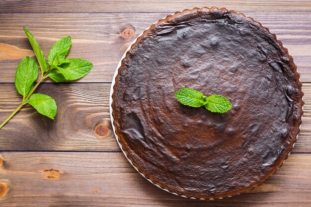 Homemade chocolate brownies with leaves of mint, Top view