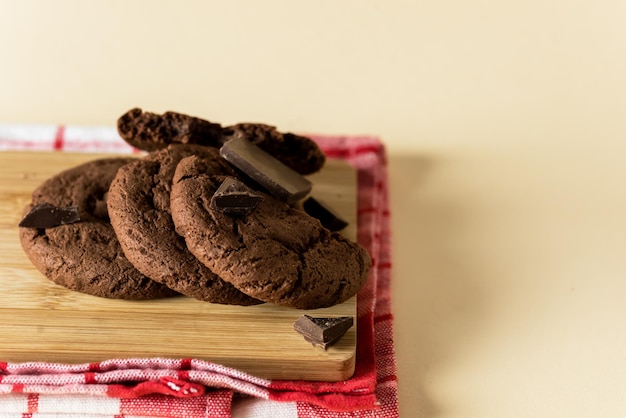 Homemade Chocolate Chip Cookies on the Wood Board Yellow Background Copy Space