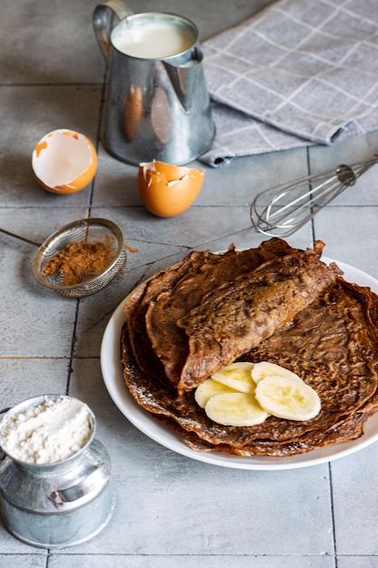 Homemade chocolate pancakes with banana