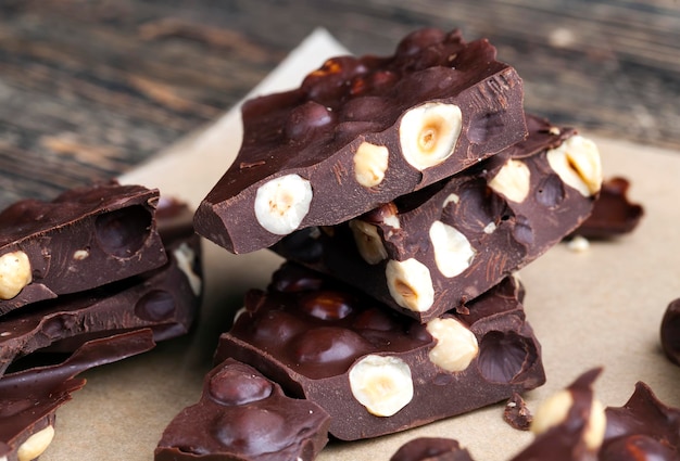 homemade chocolate with lots of cocoa and cocoa butter and roasted hazelnuts, high-quality chocolate with cocoa products and lots of hazelnuts