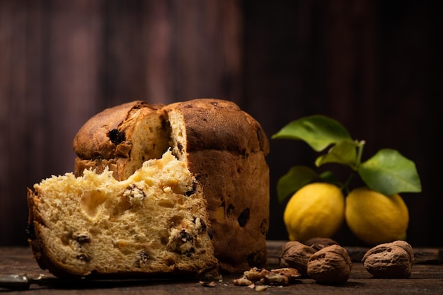 Homemade Christmas Even Panettone on a rustic wooden table close up