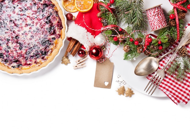 Homemade christmas pie with wild berries and sour cream, christmas decoration, closeup, isolated