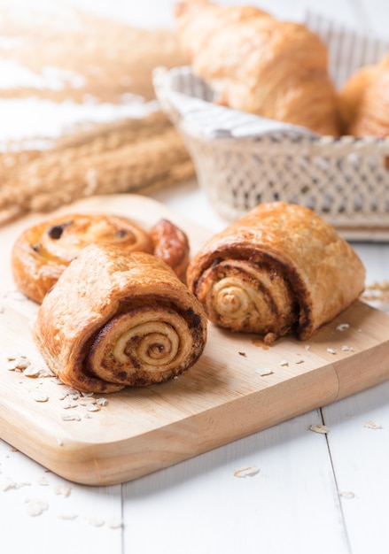 Homemade cinnamon roll bread and bakery on white wood 