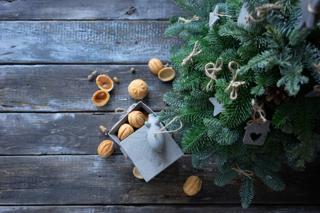 Homemade cookies-nuts stuffed with salted caramel and Christmas tree toys in the Scandinavian style