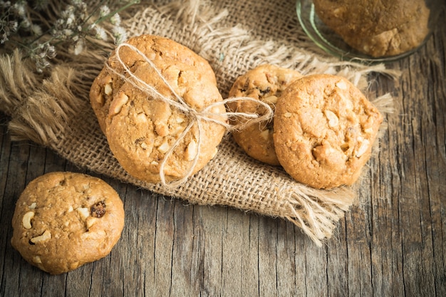 Homemade cookies on sackcloth on old wooden table