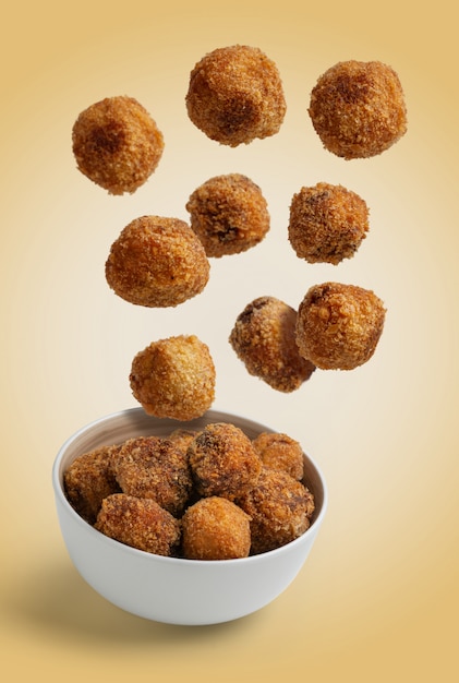 Homemade croquettes flying isolated