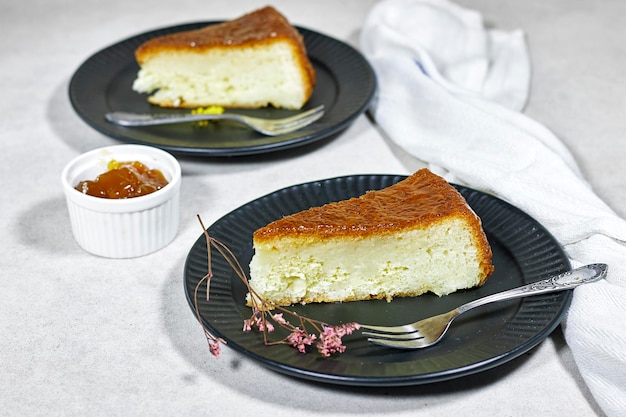 Homemade dessert rum baba with apricot jam decorated with gypsophila flower