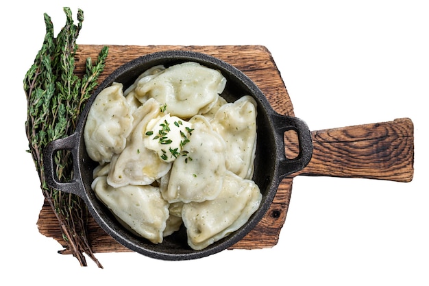 Homemade dumplings vareniki pierogi stuffed with potato in a pan Isolated white background