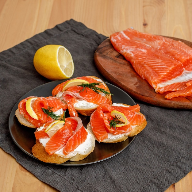 Homemade fresh salted salmon toasts with creamcheese on plate