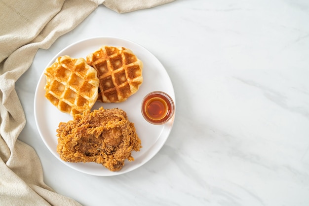 homemade fried chicken waffle with honey or maple syrup