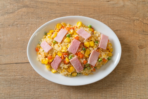 homemade fried rice with ham and mixed vegetable (carrot, green bean peas, carrot)