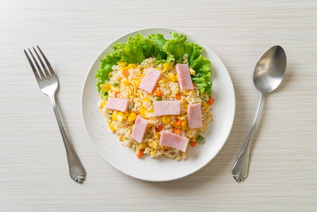 homemade fried rice with ham and mixed vegetable (carrot, green bean peas, carrot)