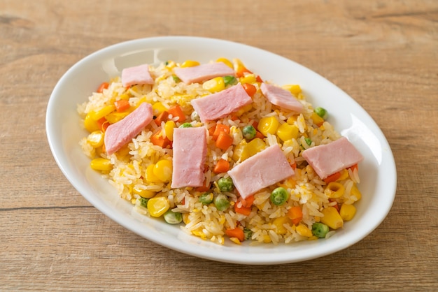 homemade fried rice with ham and mixed vegetable (carrot, green bean peas, carrot)