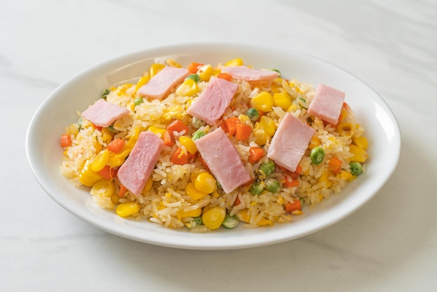 homemade fried rice with ham and mixed vegetable (carrot, green bean peas, carrot)