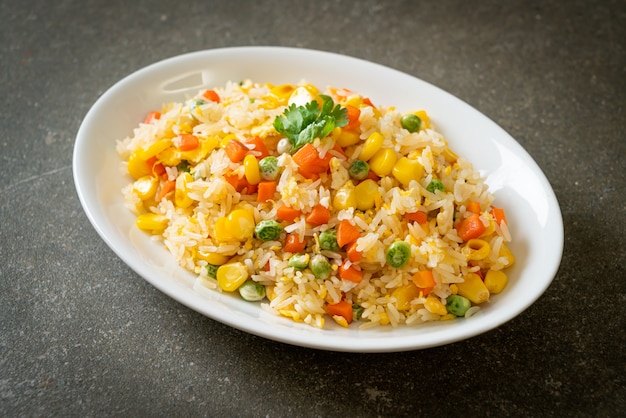 homemade fried rice with mixed vegetable (carrot, green bean peas, corn) and egg