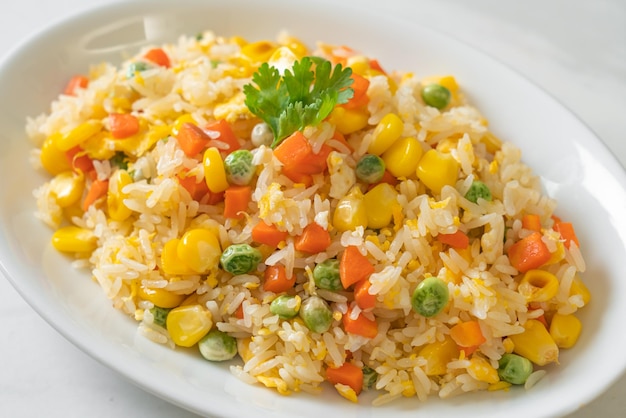 homemade fried rice with mixed vegetable (carrot, green bean peas, corn) and egg