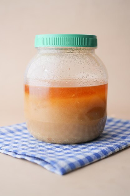 Homemade ghee in container on a table