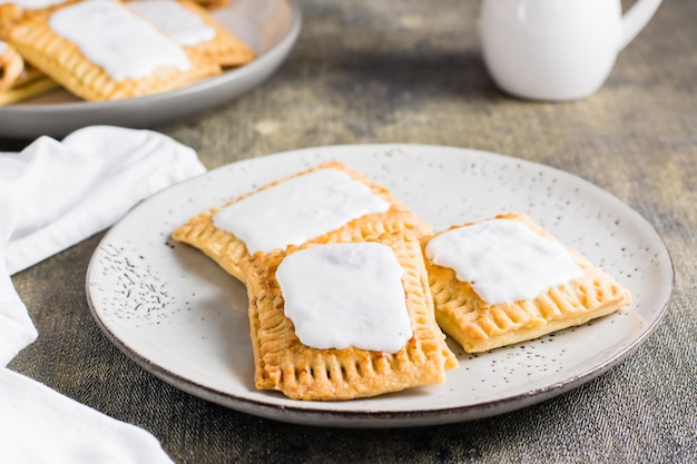 Homemade glazed pop tarts on a plate American pastry