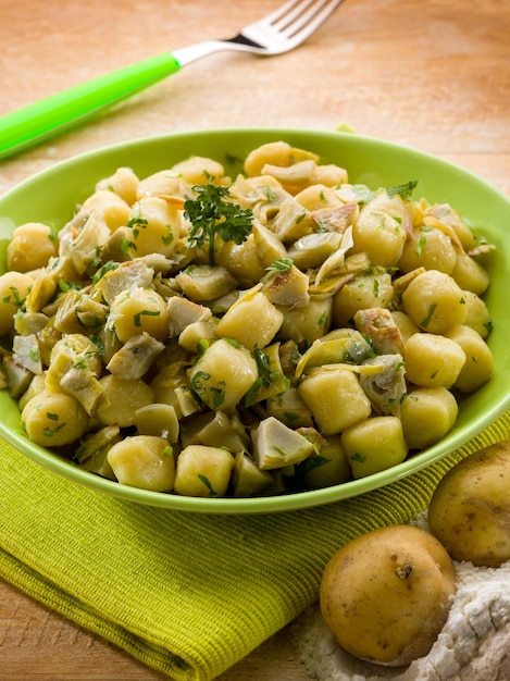 Homemade gnocchi with artichokevegetarian food